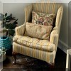 F61. Striped wingback chair. 
